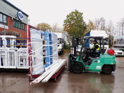 White Profile Being Unloaded By Forklift White Profile Being Unloaded By Forklift